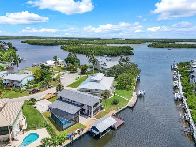Aerial perspective of suburban area with a large body of water