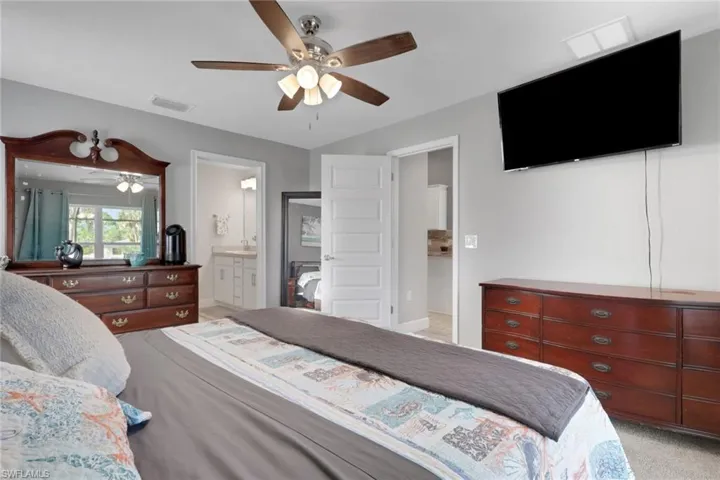Interior room with light gray walls, a ceiling fan with integrated lighting, and light-colored flooring