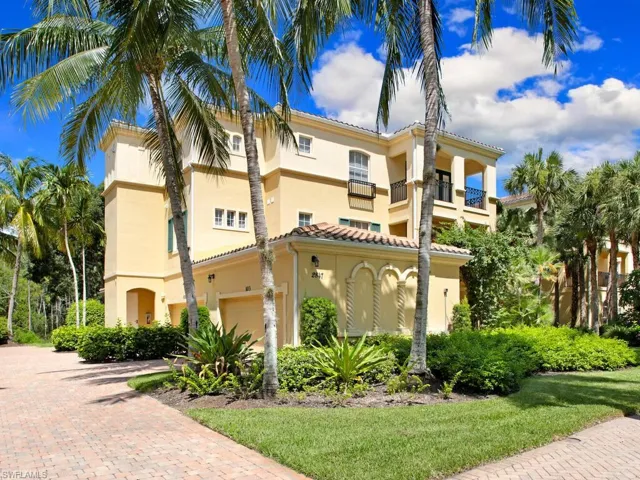 Mediterranean / spanish house featuring stucco siding, a garage, and decorative driveway