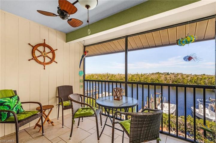 Screened porch with views across the harbor to the mangroves