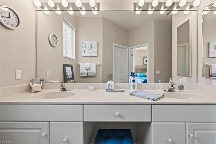 Bathroom featuring vanity and ensuite bathroom
