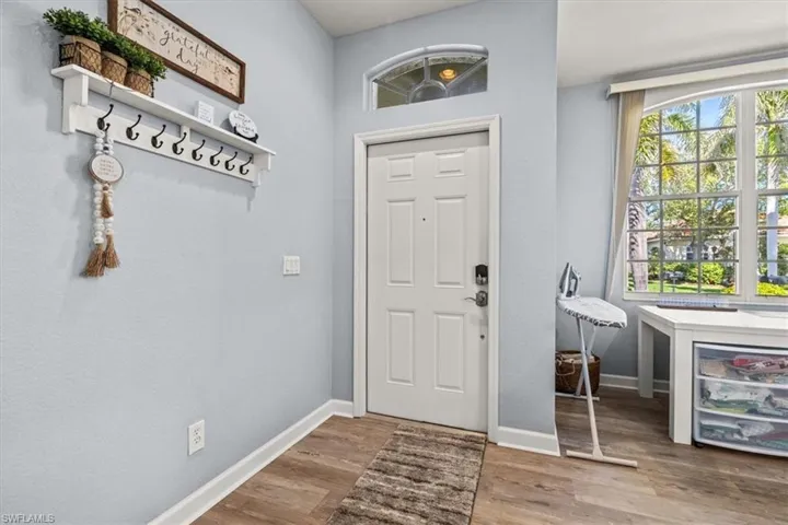 Dining area featuring light wood-type flooring, baseboards, and rail lighting