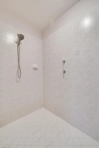 Full bathroom with a tile shower