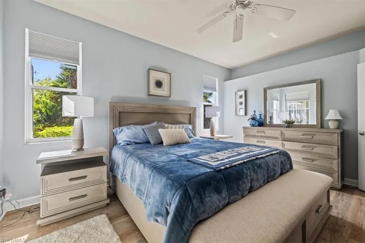 Master Bedroom featuring ceiling fan, baseboards, and wood finished floors
