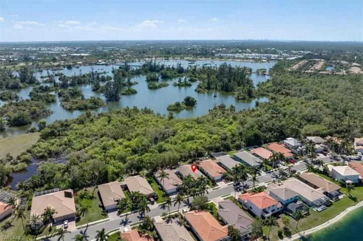 Aerial view featuring a residential view and a water view