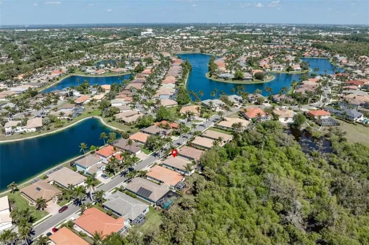 Drone / aerial view with a residential view and a water view