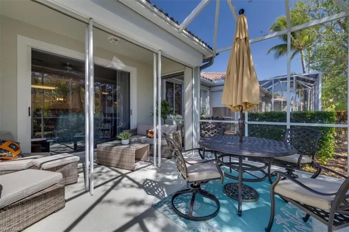 View of patio / terrace featuring a lanai