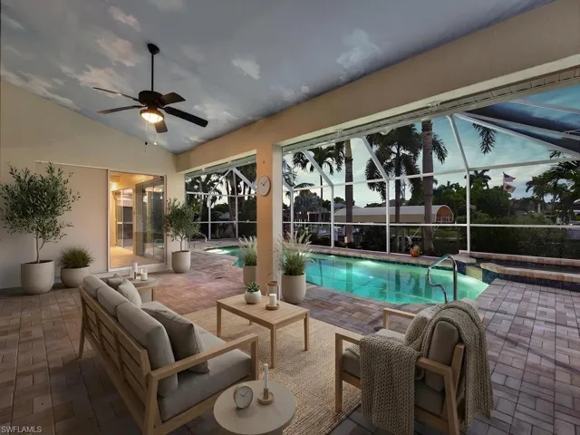 Screened lanai featuring a swimming pool and spa