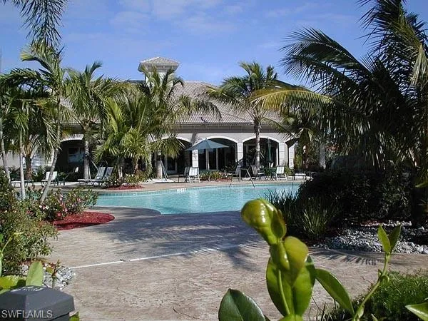 Community pool featuring a patio area