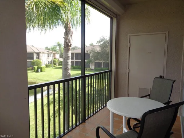 Balcony featuring a sunroom