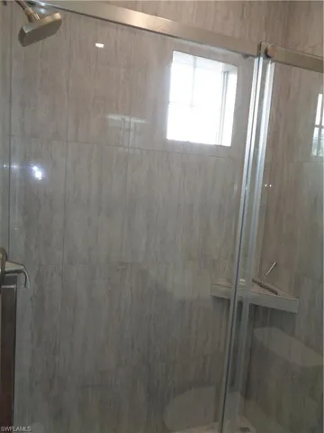 Bathroom featuring a shower stall