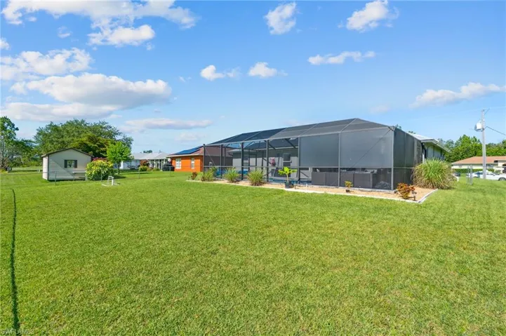 View of yard with glass enclosure