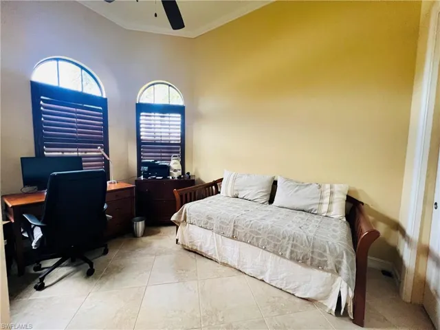 Den/office with desk and daybed