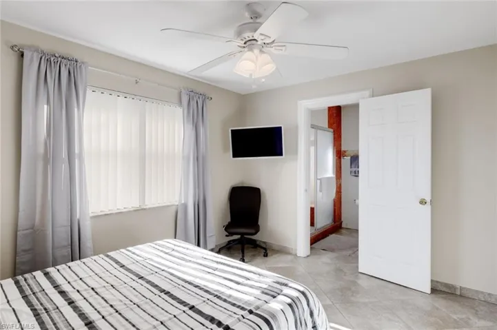 Bedroom featuring ceiling fan and light tile patterned floors