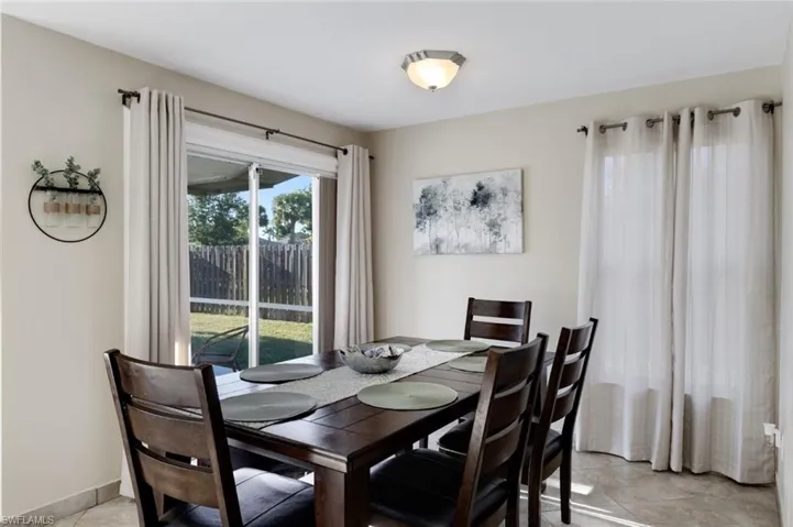 Dining room featuring light tile patterned floors