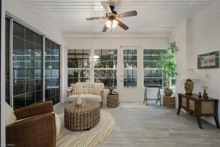 Sunroom featuring wooden ceiling and wood finished floors