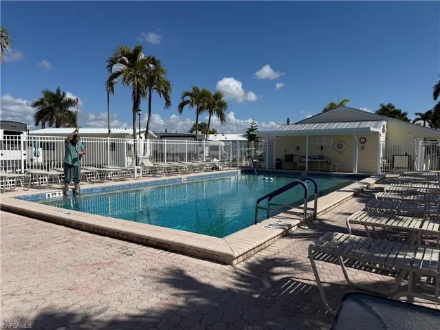 Community pool featuring a patio area