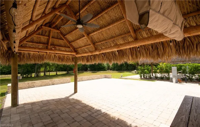 View of patio with a gazebo and ceiling fan
