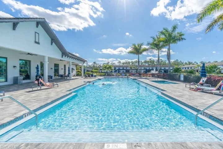 Community pool with a patio area