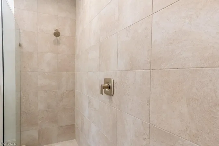 Bathroom view of a tile shower