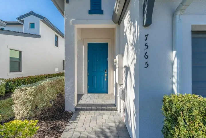 View of exterior entry with stucco siding