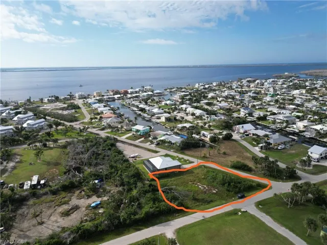 Aerial view of residential area with a nearby body of water