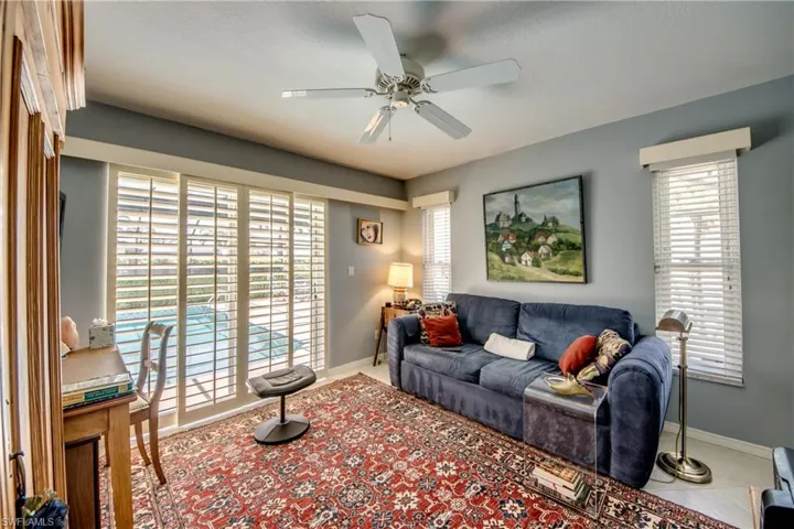 Living area with a ceiling fan and healthy amount of natural light
