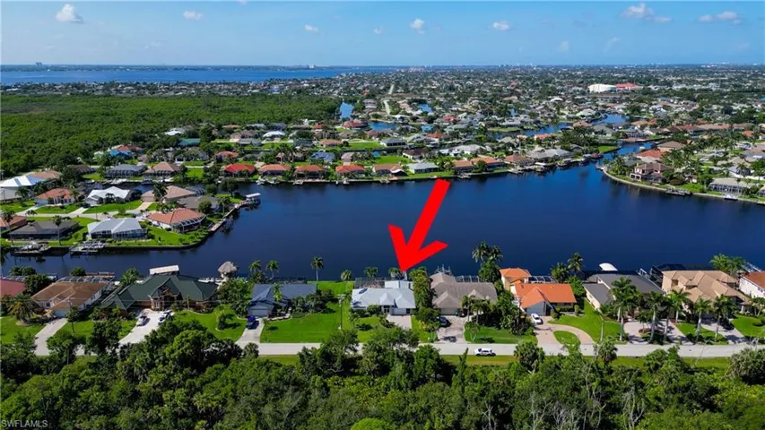View of property location featuring nearby suburban area and a nearby body of water