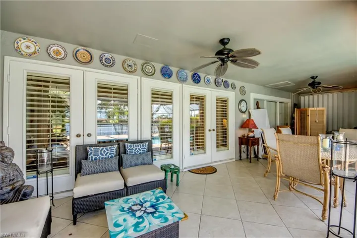 Sunroom featuring french doors