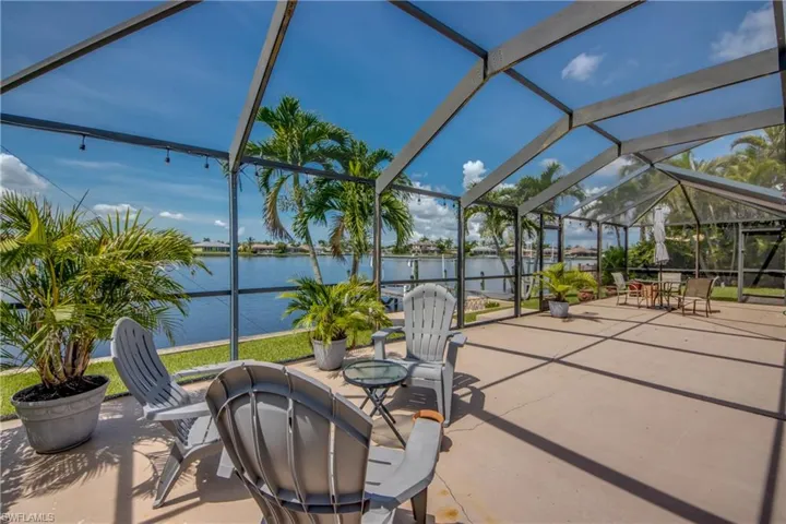 View of patio / terrace with a water view and glass enclosure