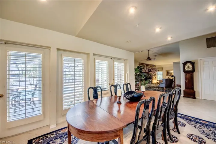 Dining room featuring light tile patterned flooring, ceiling fan, healthy amount of natural light, and recessed lighting