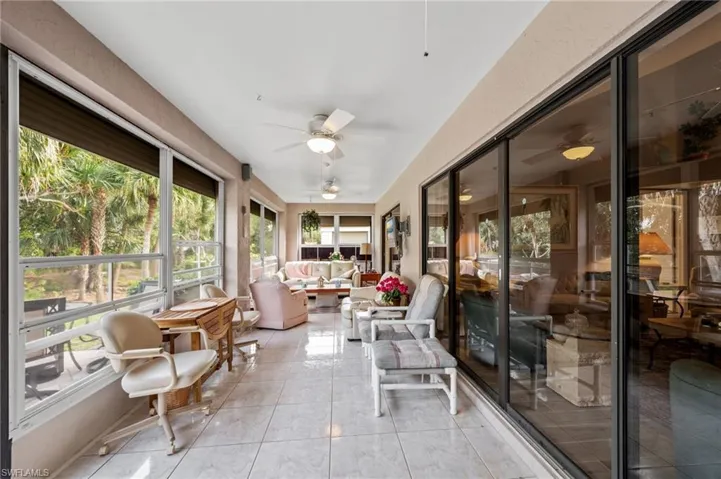 Sunroom / solarium featuring an outdoor living space and ceiling fan