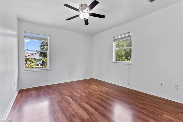 Spare room featuring wood finished floors and ceiling fan