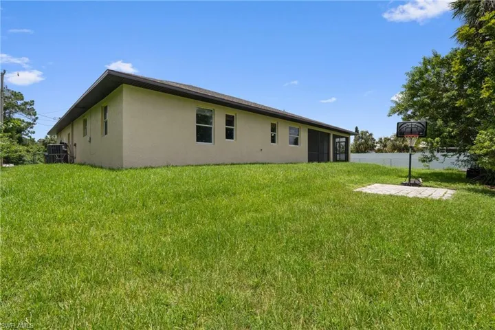 Back of property featuring stucco siding