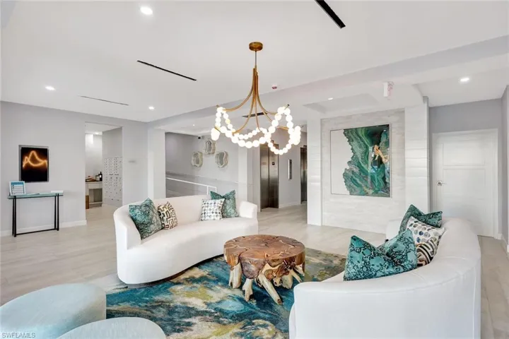 Living area featuring recessed lighting, a chandelier, and light wood-style floors