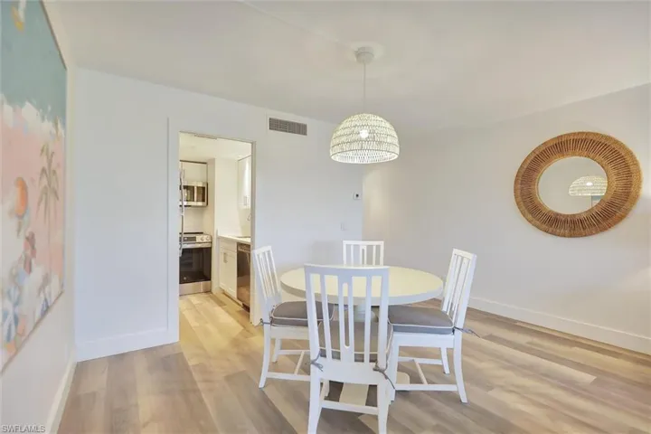 Dining area with light wood-style flooring