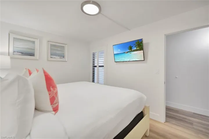 Bedroom featuring light wood-style floors and baseboards
