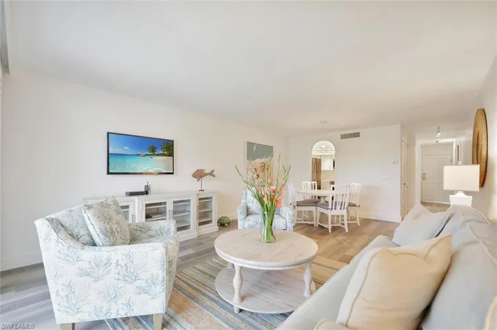 Living room with wood finished floors and baseboards