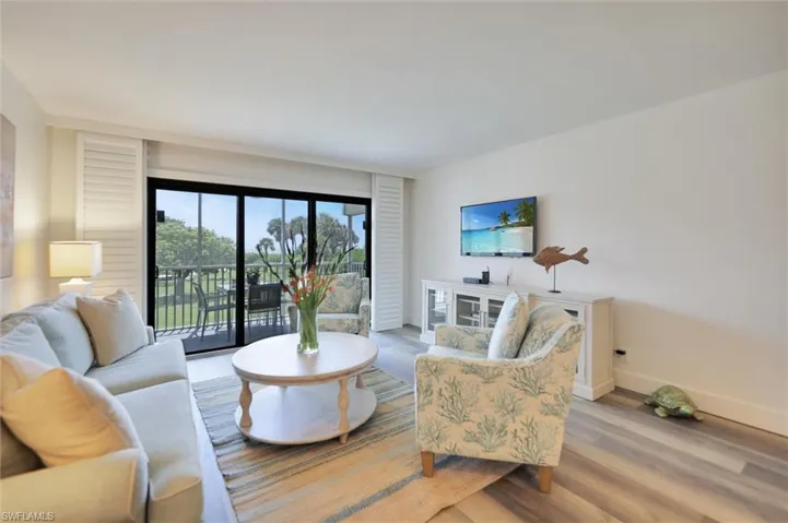 Living room featuring wood finished floors and baseboards