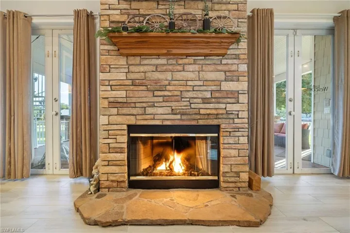 Interior details featuring a fireplace and french doors