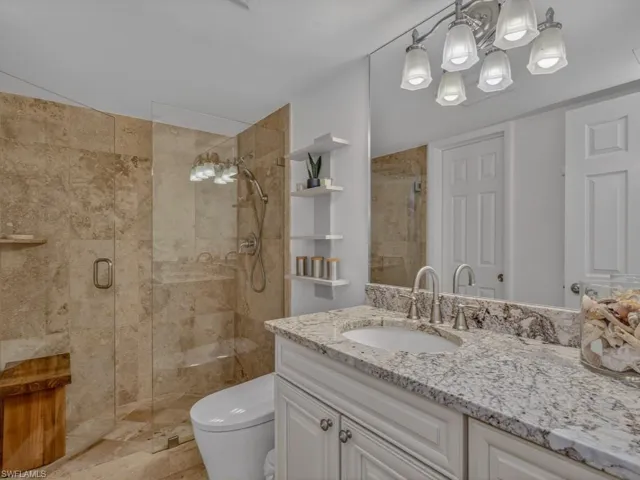 Second full Bathroom with stone tiled shower, upgraded fixtures and added bidet