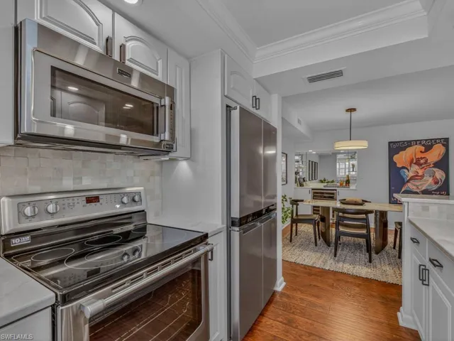 Nice bright white Kitchen has been upgraded by owner. Opening up walls, adding new appliances, beautiful designer tile backsplash, countertops and more.