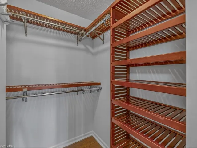 Both Bedrooms feature walk in Closets with wood shelving and an additional bonus hallway closet for extra storage.