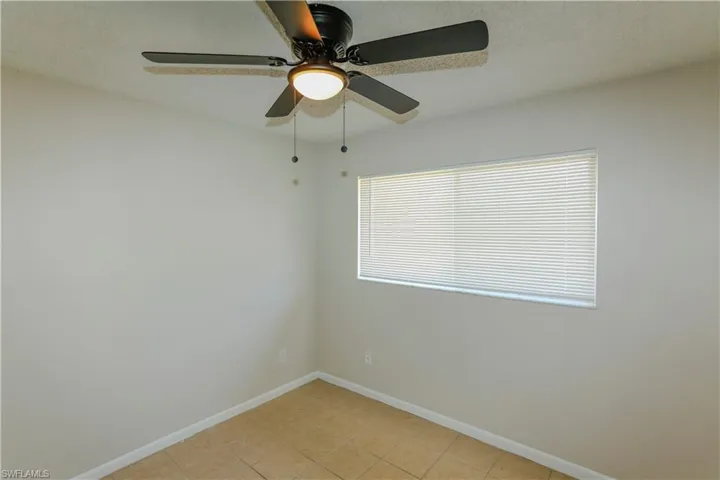 Neutral wall finishes complement the textured ceiling