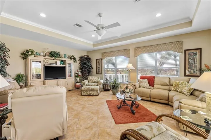 This amazing room has so much space! It has views of the canal and sliders to the screened pool/lanai!