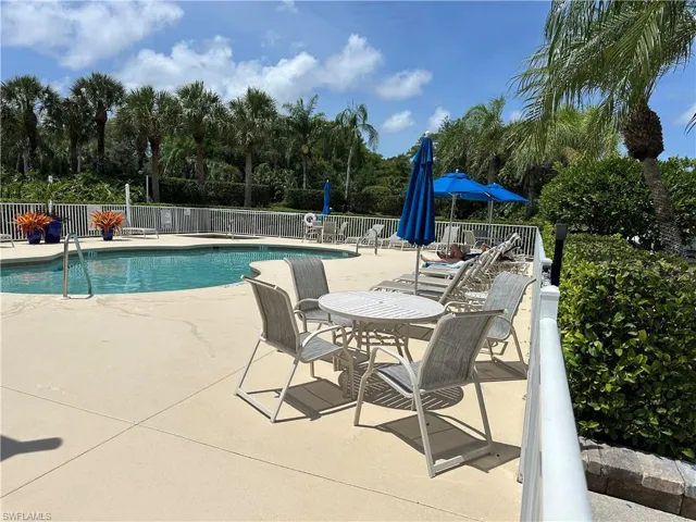 Community pool with a patio area
