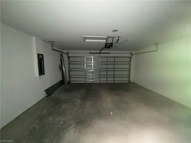 Laundry room featuring dark wood-style floors, hookup for an electric dryer, and hookup for a washing machine