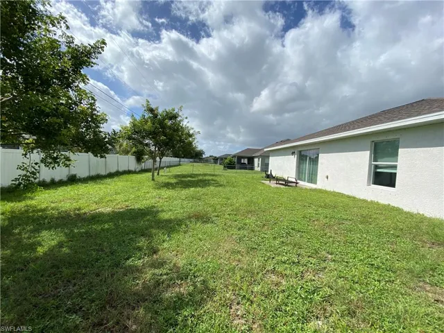 View of fenced backyard