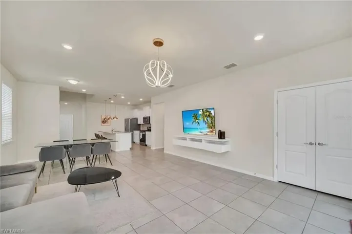 Living room featuring recessed lighting and light tile patterned floors