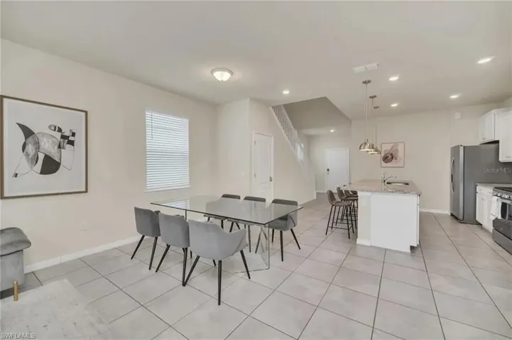 Dining area featuring baseboards and light tile patterned floors